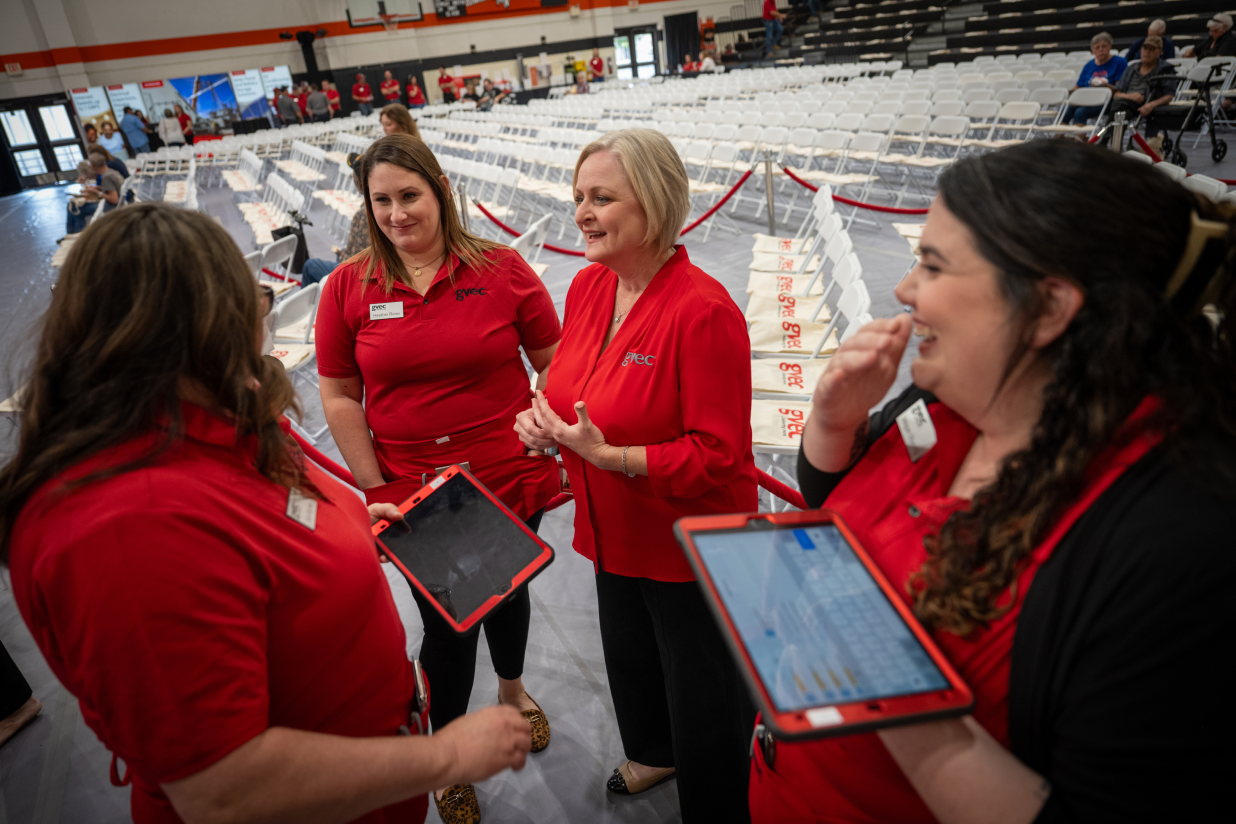 Co-workers conversing at an event